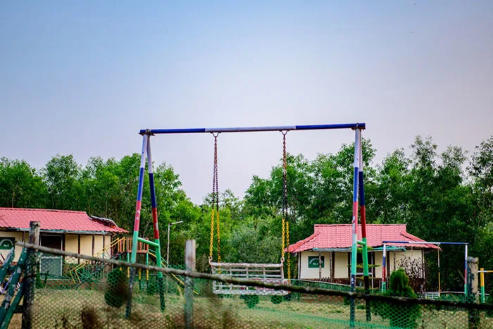 Open recreation ground surrounded by forest hills